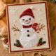 Handgemaakte kerstkaart met een geborduurde sneeuwpop in witte en rode waaiersteek